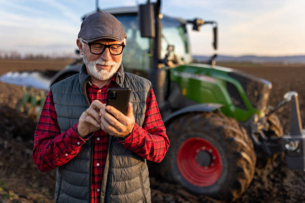Happy farmer with tractor